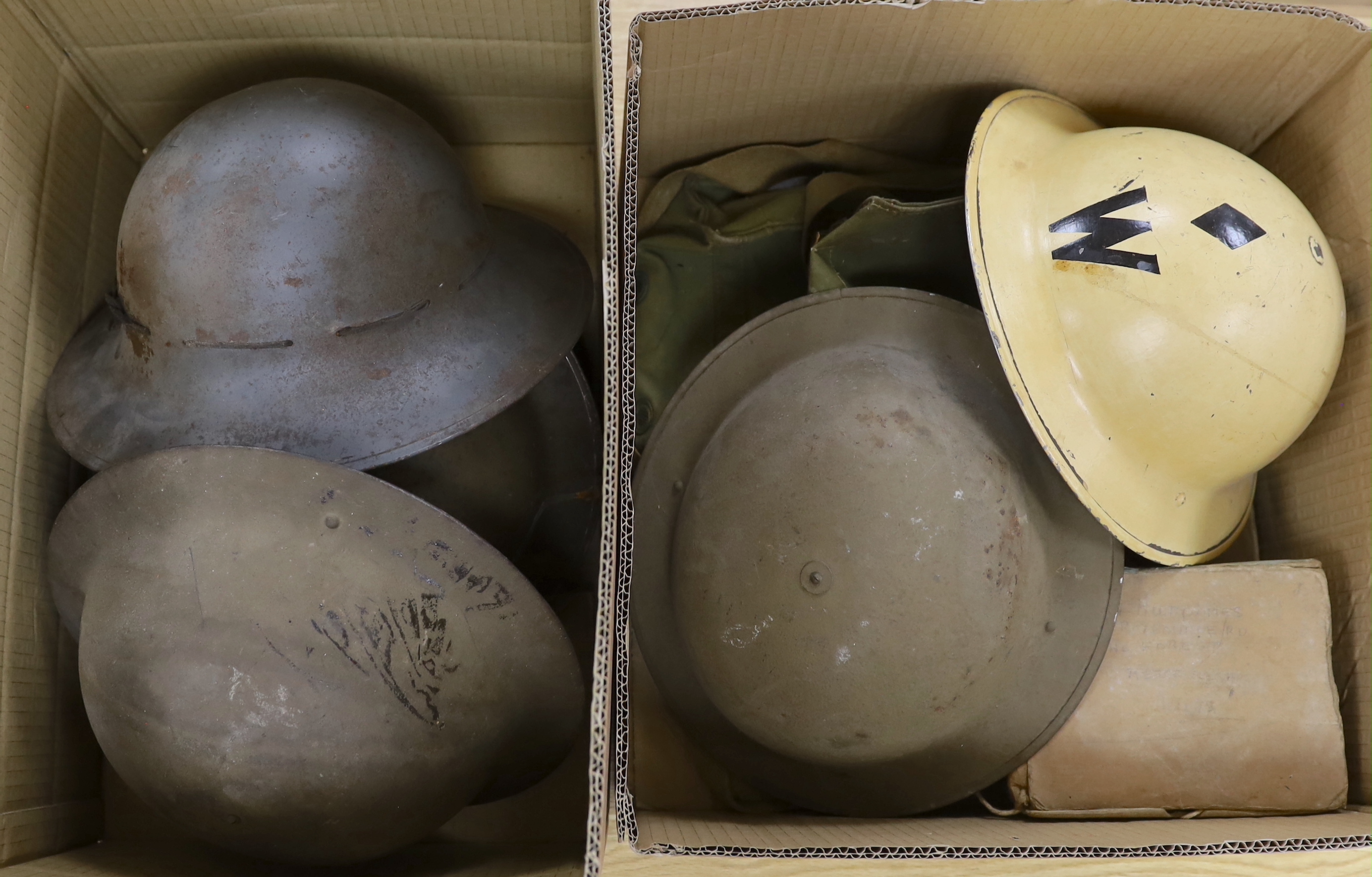 Six military etc. tin helmets. Including an example, painted as an Air Raid Warden’s helmet, with other items, including a military shoulder bag etc.